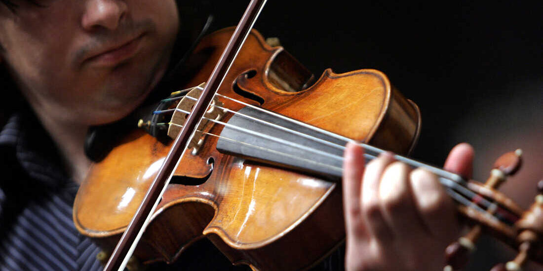 Violinist Adrian Pintea, from The Julliard School, plays a 1729 Stradivari known as the "Solomon, Ex-Lambert" in 2007 at Christie's in New York